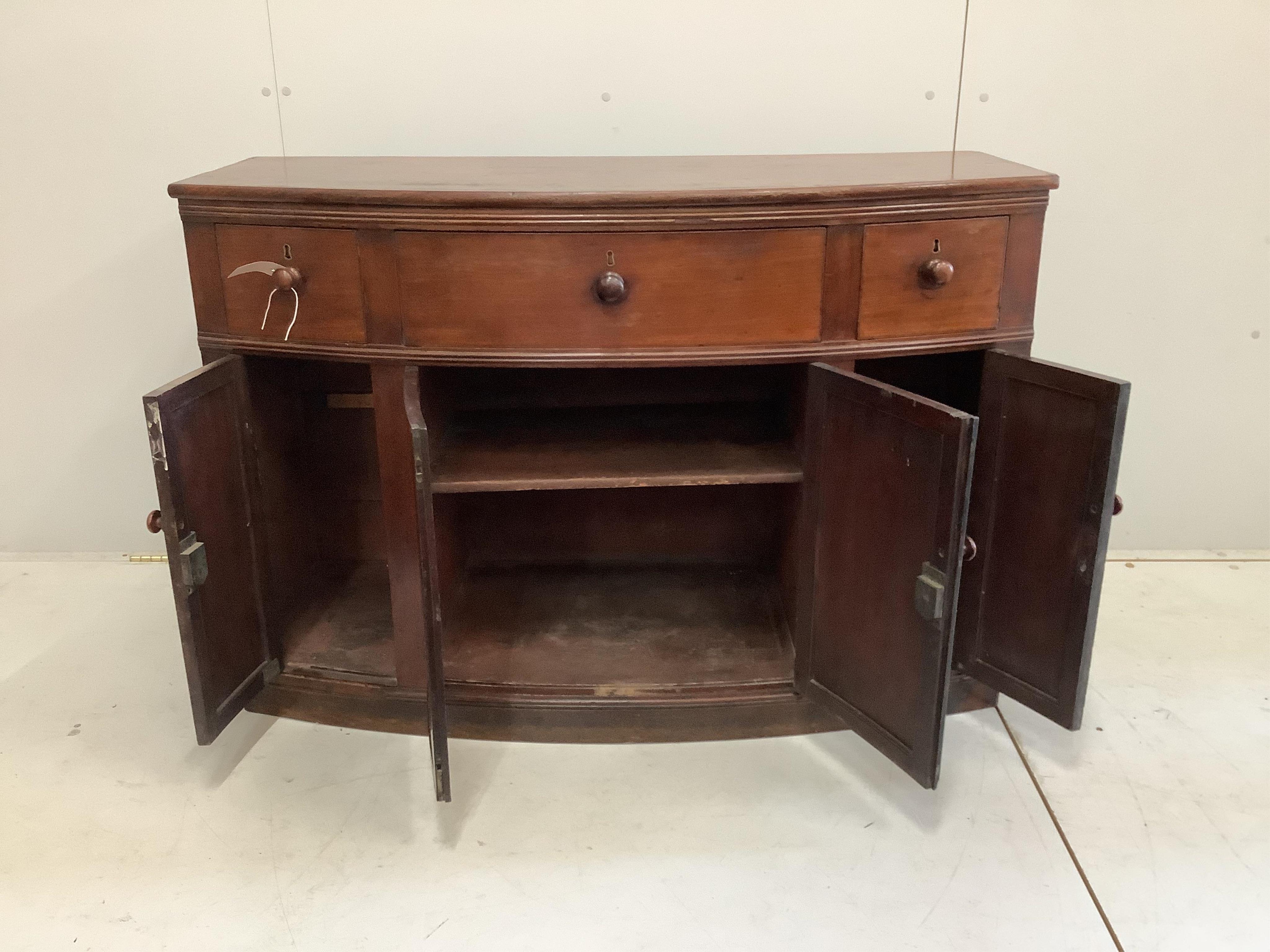 A Regency mahogany bowfront side cabinet, width 120cm, depth 49cm, height 83cm. Condition - fair